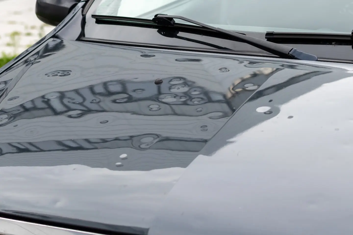 Moderate hail damage on a car before coming to Hail-Tech PDR.